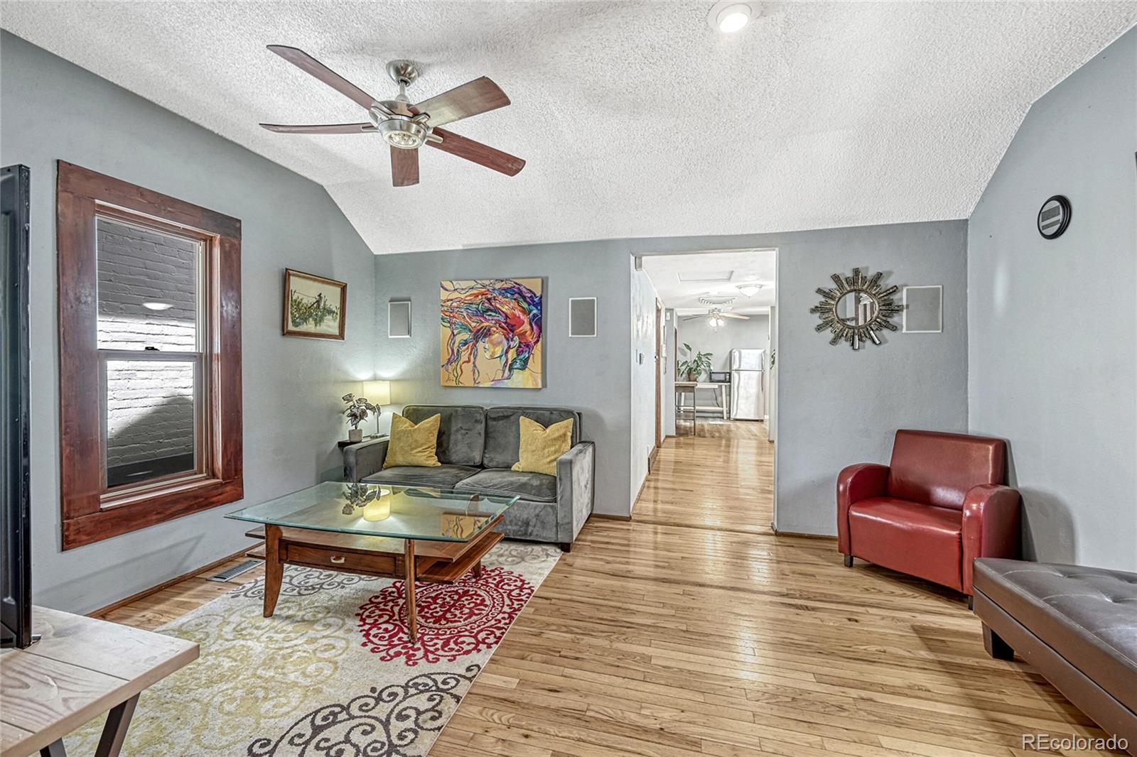 944 Inca Street Denver, CO 80204 - Photo 8 of 29 a living room with furniture and a window