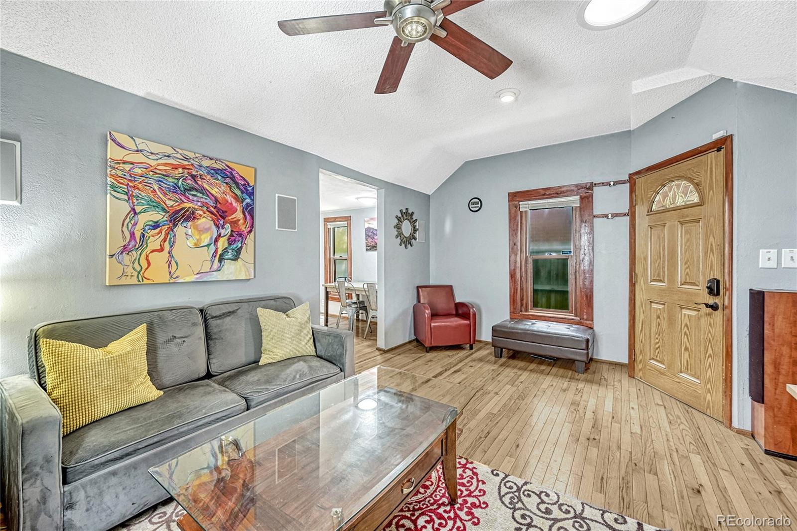 944 Inca Street Denver, CO 80204 - Photo 9 of 29 a bedroom with furniture and a wooden floor