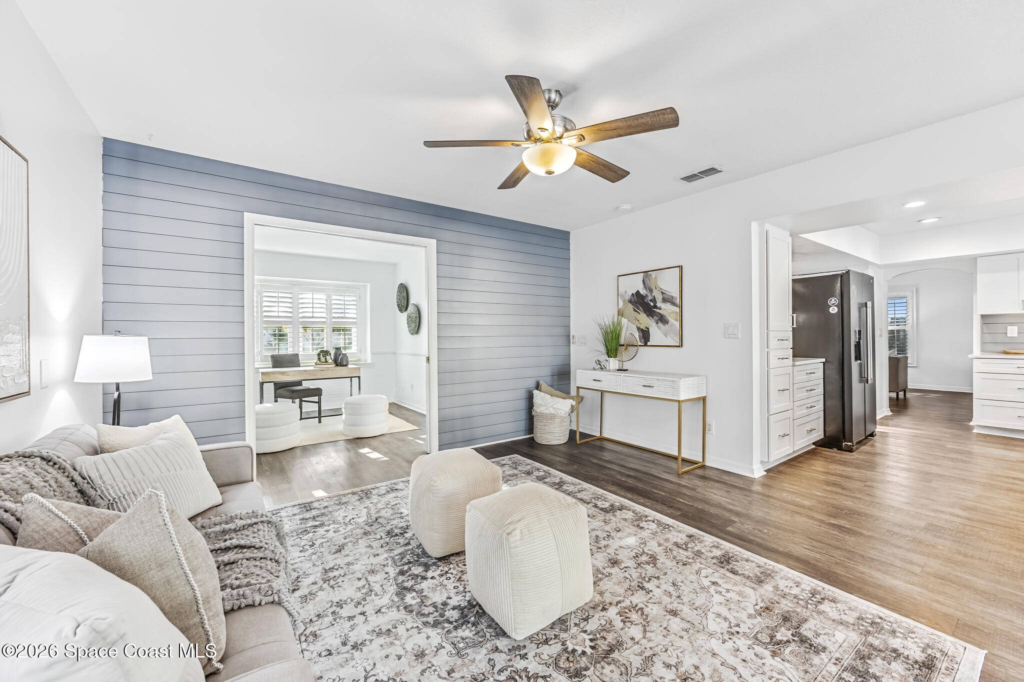 3069 Rio Bonita Street Indialantic, FL 32903 - Photo 12 of 46 a living room with furniture and wooden floor