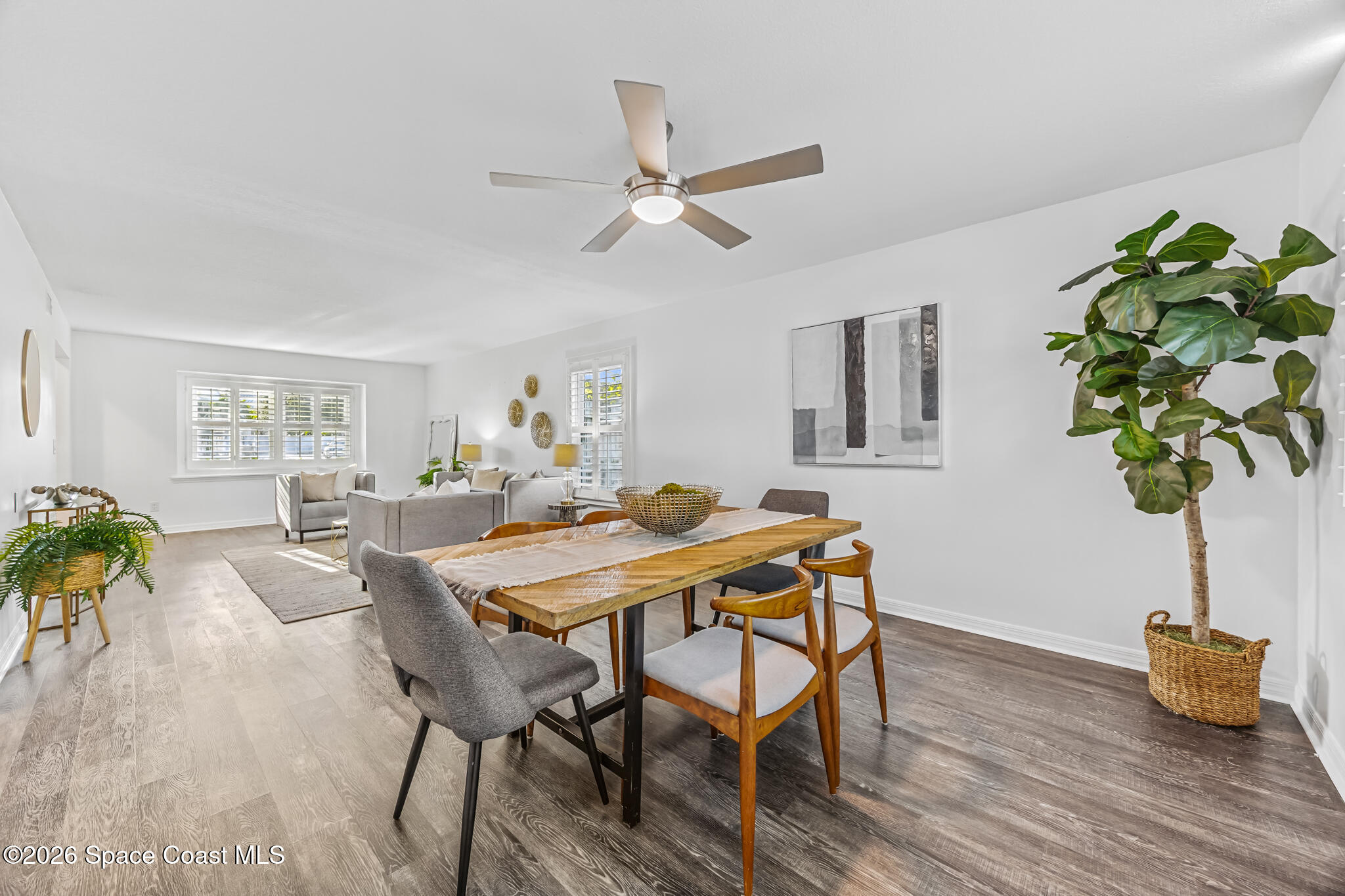 3069 Rio Bonita Street Indialantic, FL 32903 - Photo 15 of 46 a view of a dining room with furniture window and wooden floor