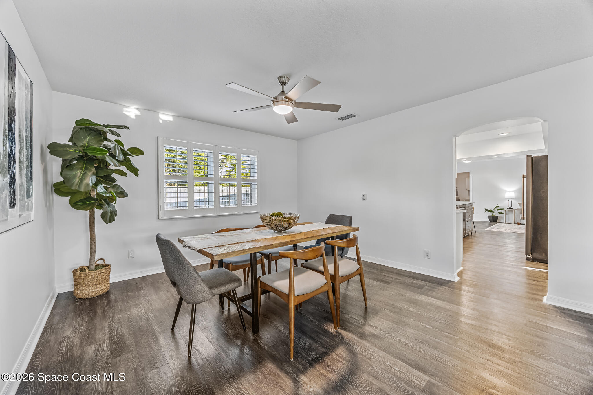 3069 Rio Bonita Street Indialantic, FL 32903 - Photo 16 of 46 a view of a dining room with furniture window and wooden floor