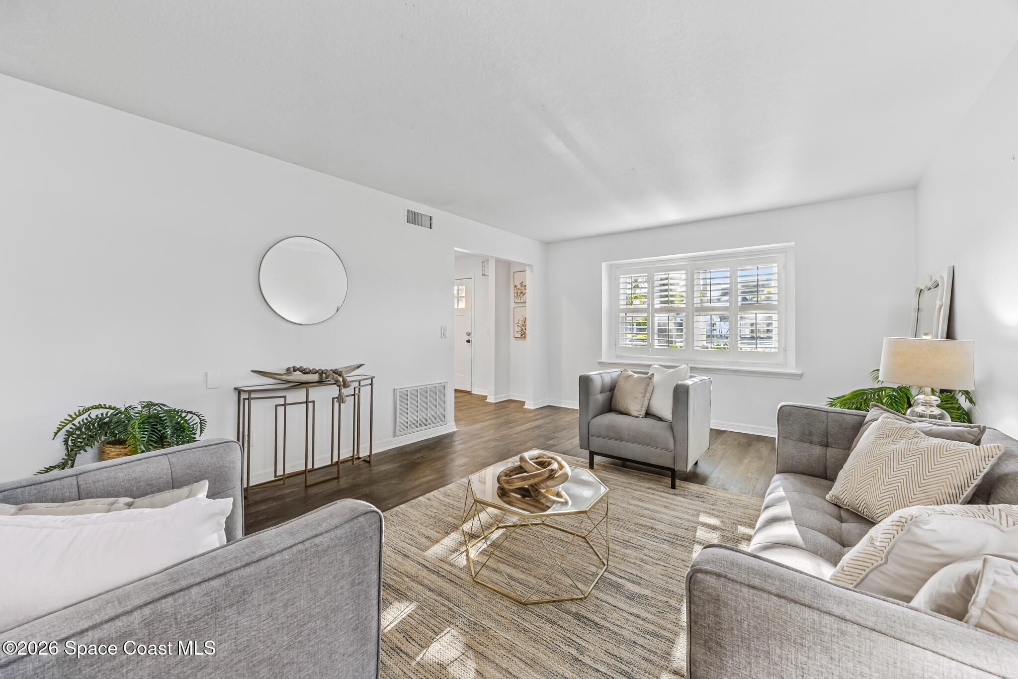 3069 Rio Bonita Street Indialantic, FL 32903 - Photo 17 of 46 a living room with furniture and a window