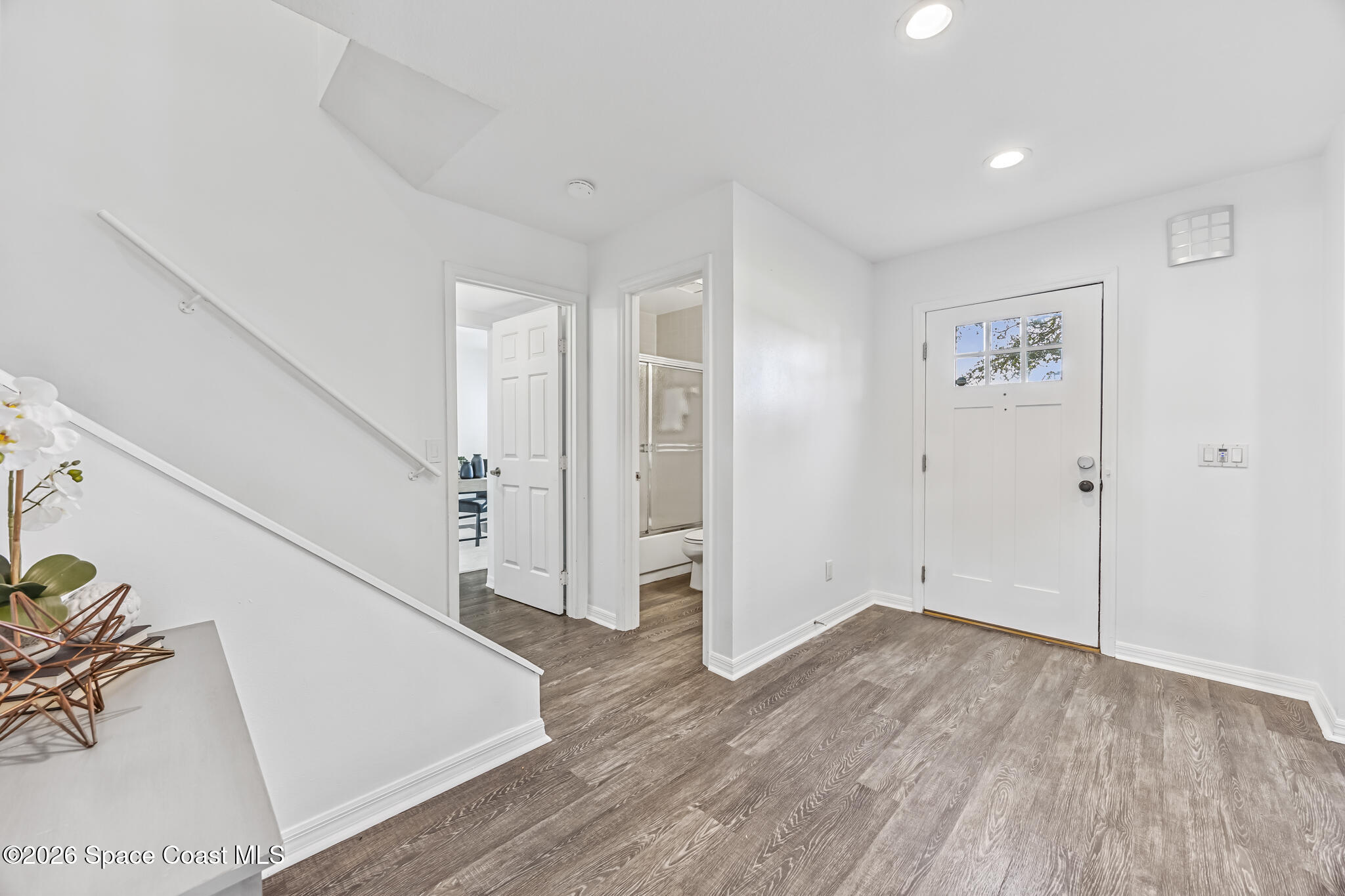 3069 Rio Bonita Street Indialantic, FL 32903 - Photo 23 of 46 a view of entryway with wooden floor