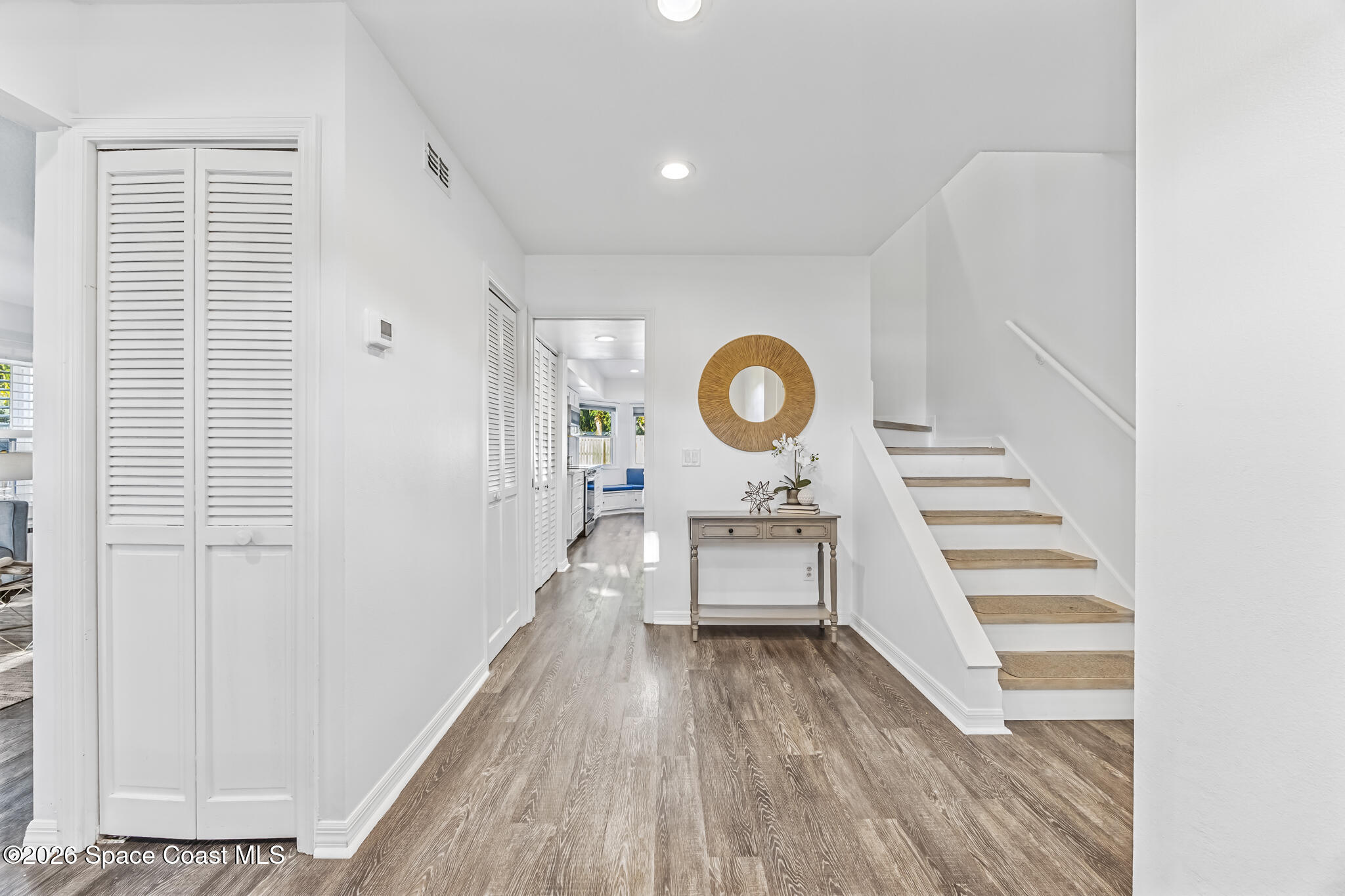 3069 Rio Bonita Street Indialantic, FL 32903 - Photo 23 of 48 a view of a hallway with wooden floor and cabinets