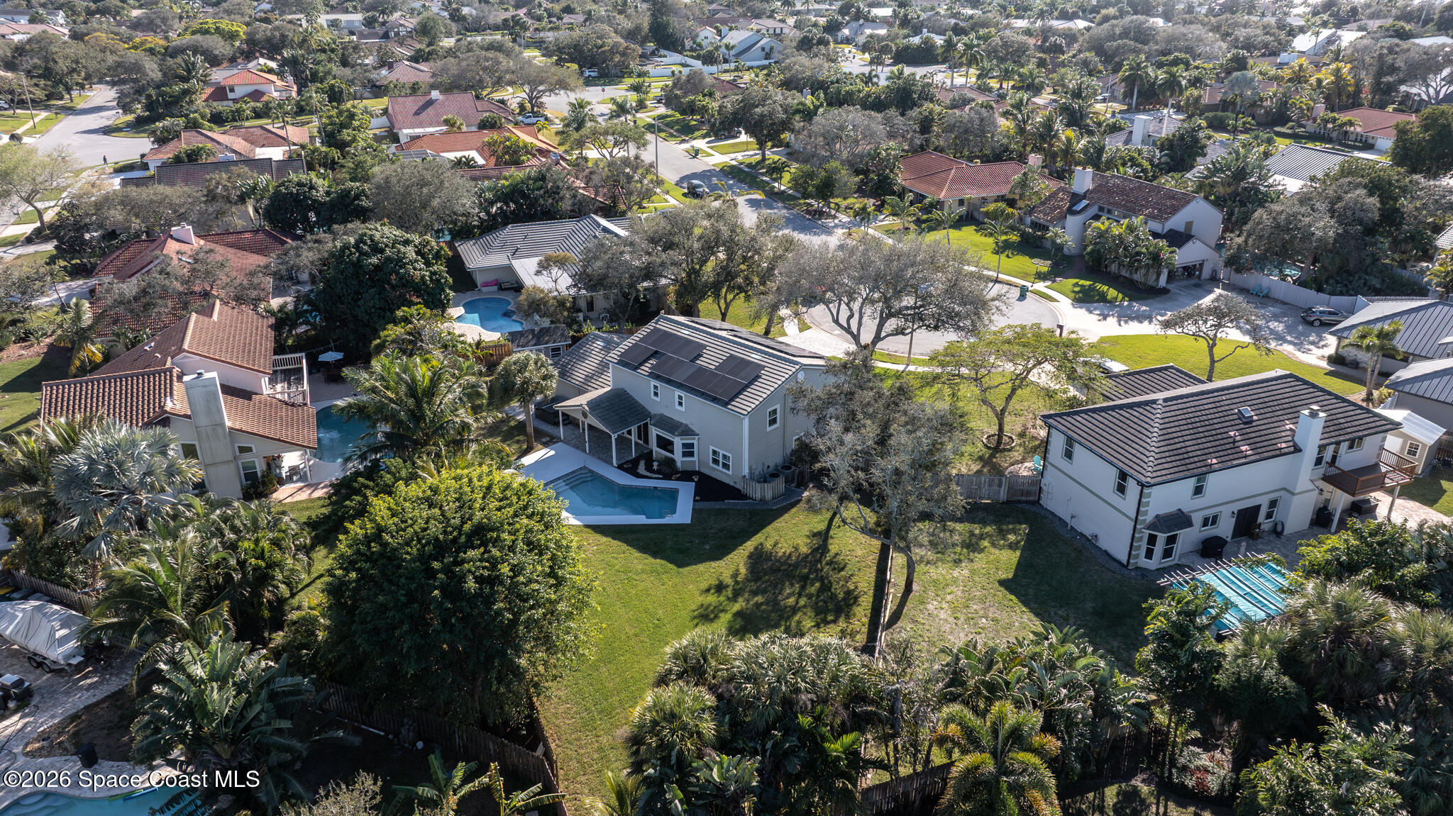 3069 Rio Bonita Street Indialantic, FL 32903 - Photo 3 of 48 an aerial view of a house with a yard and garden