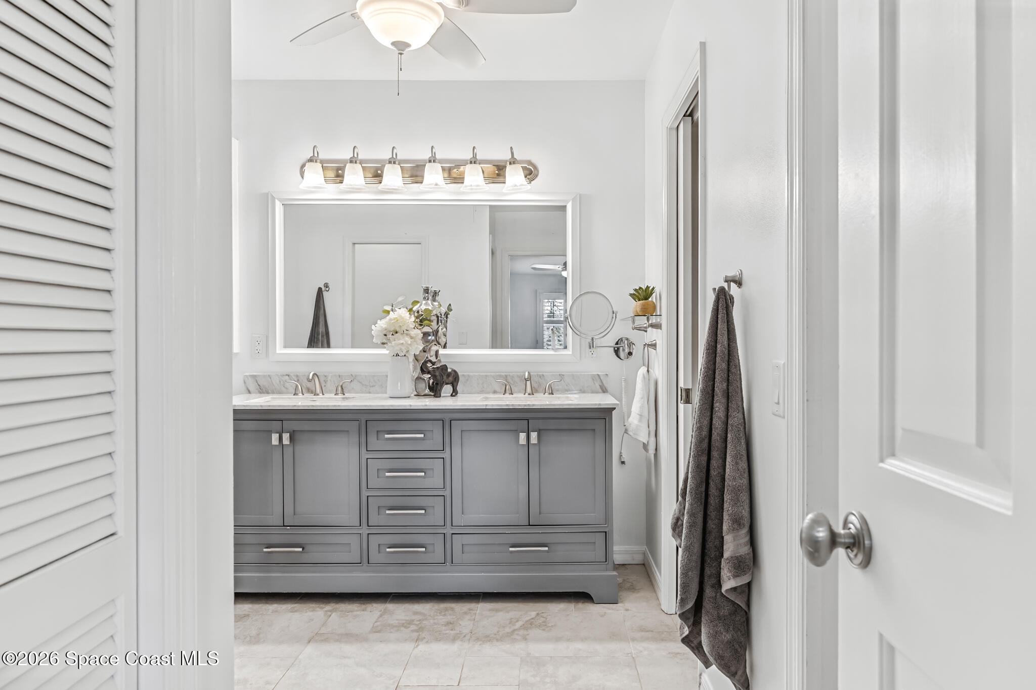 3069 Rio Bonita Street Indialantic, FL 32903 - Photo 31 of 46 a bathroom with a sink vanity and a mirror