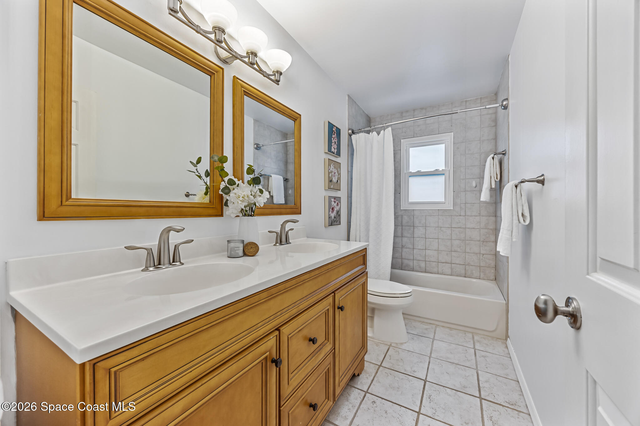 3069 Rio Bonita Street Indialantic, FL 32903 - Photo 36 of 48 a bathroom with a sink a toilet and shower