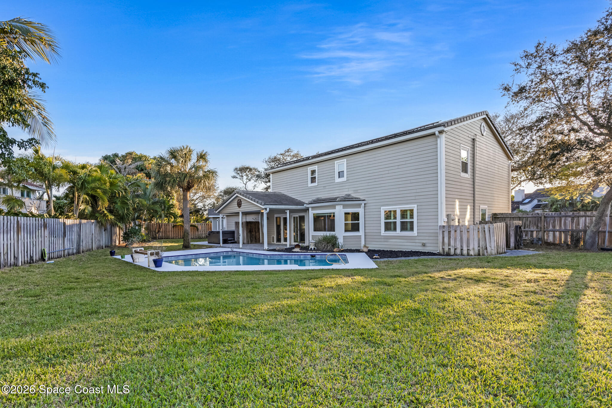 3069 Rio Bonita Street Indialantic, FL 32903 - Photo 4 of 48 a front view of house with yard and swimming pool