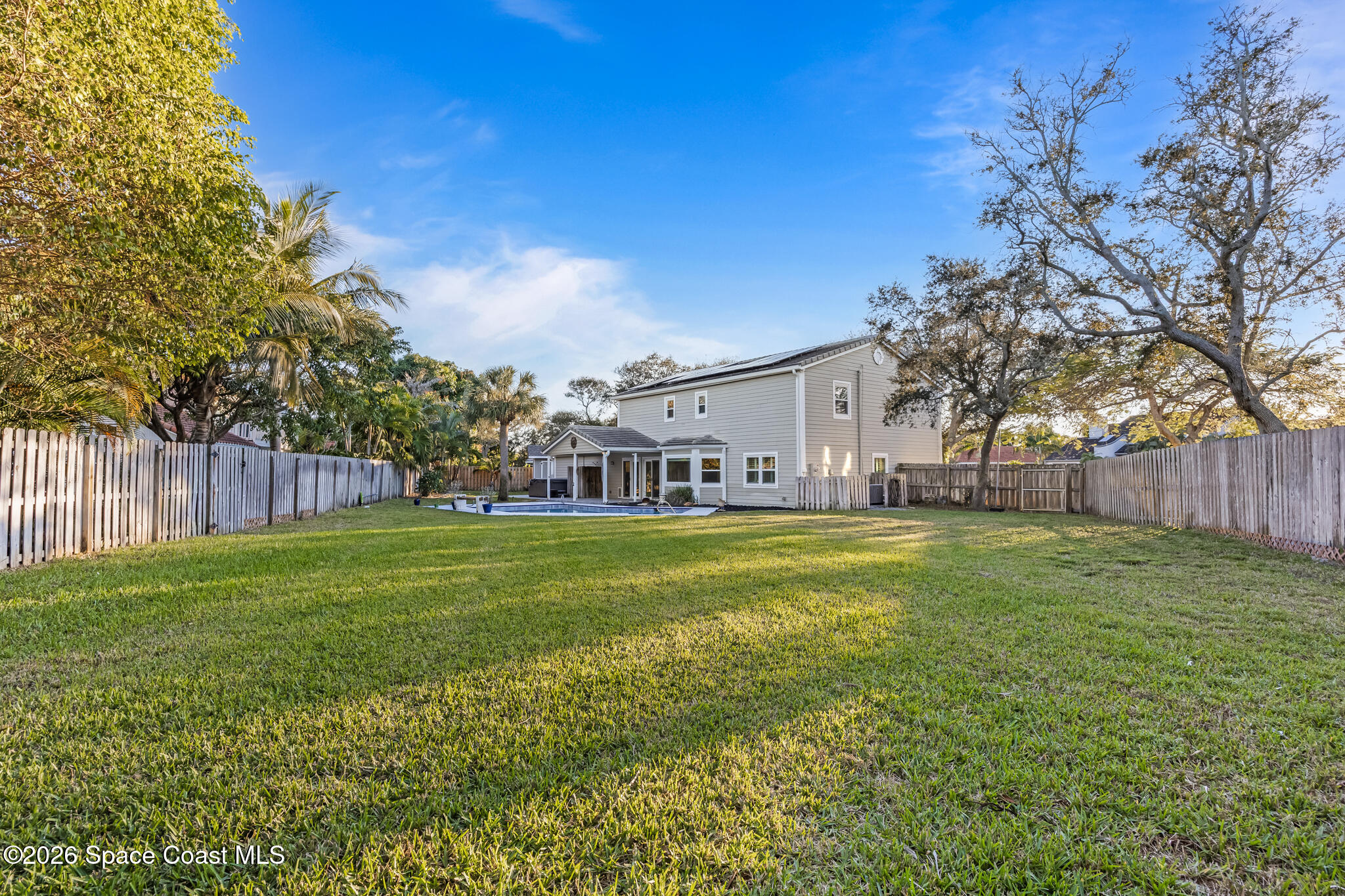 3069 Rio Bonita Street Indialantic, FL 32903 - Photo 42 of 48 a view of a house with a big yard
