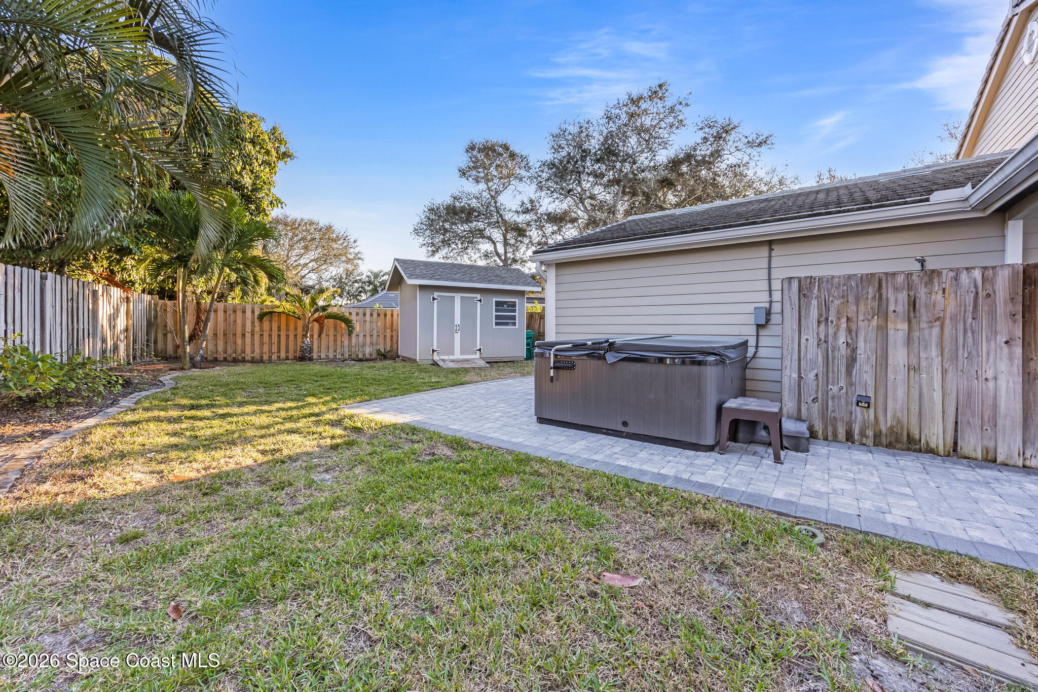 3069 Rio Bonita Street Indialantic, FL 32903 - Photo 43 of 46 a view of a house with a yard and sitting area