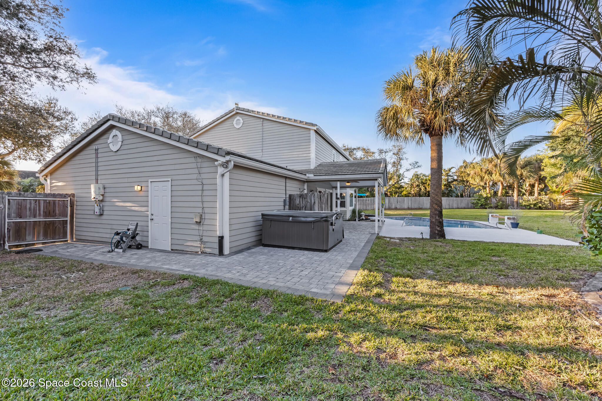 3069 Rio Bonita Street Indialantic, FL 32903 - Photo 47 of 48 a front view of a house with garden