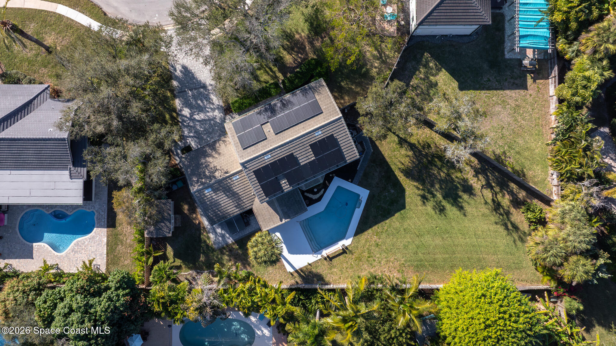 3069 Rio Bonita Street Indialantic, FL 32903 - Photo 48 of 48 an aerial view of a house with a yard and garden