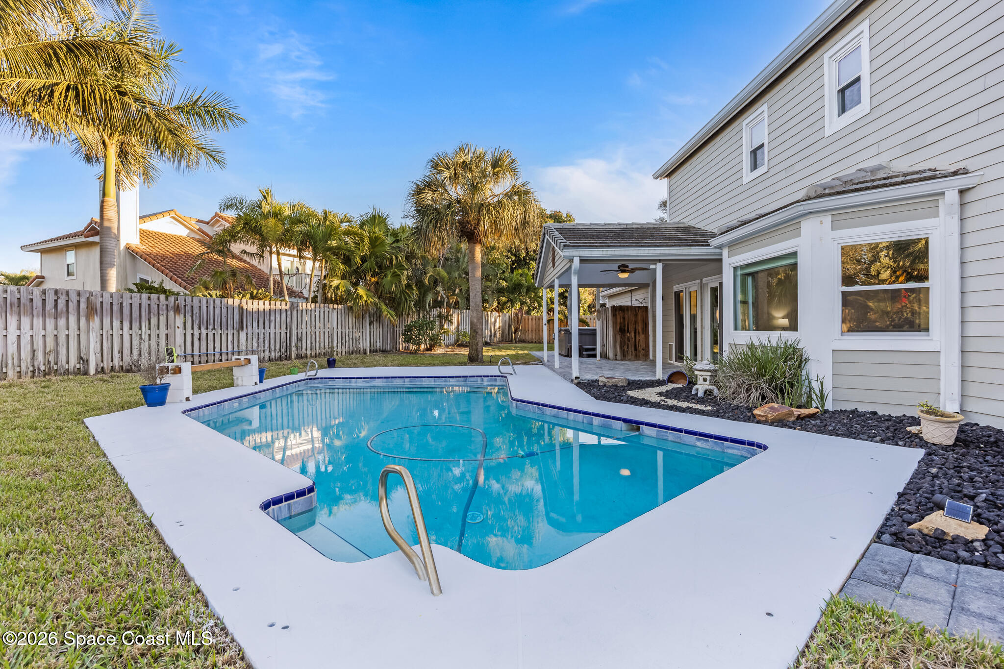 3069 Rio Bonita Street Indialantic, FL 32903 - Photo 5 of 48 a view of a house with swimming pool and sitting area