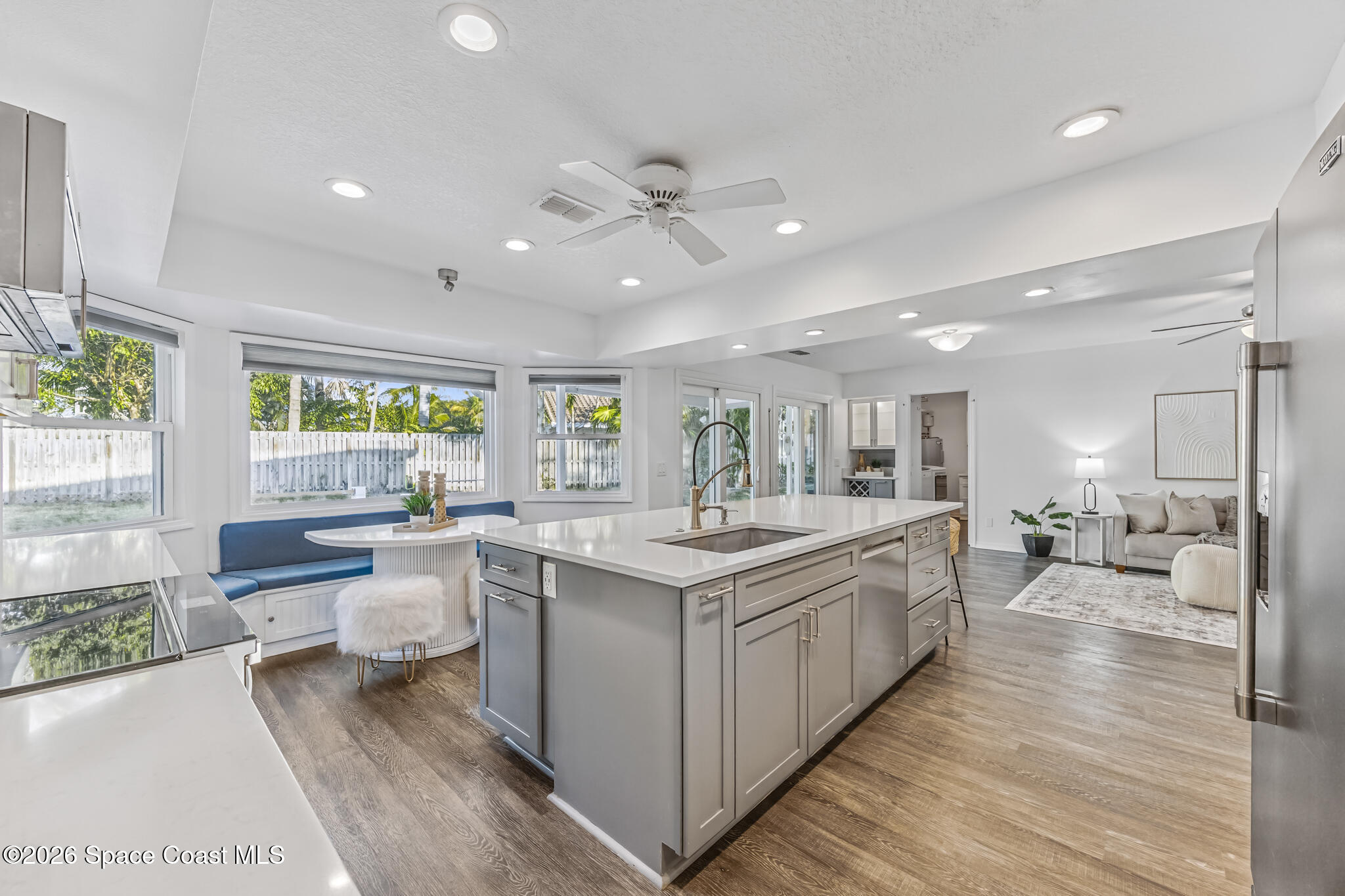 3069 Rio Bonita Street Indialantic, FL 32903 - Photo 8 of 48 a large kitchen with stainless steel appliances a lot of counter space and a wooden floors
