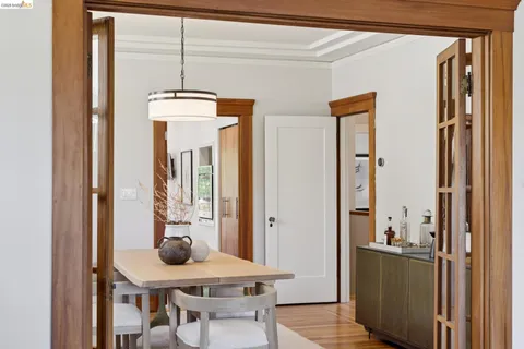 a view of a dining room with furniture and window