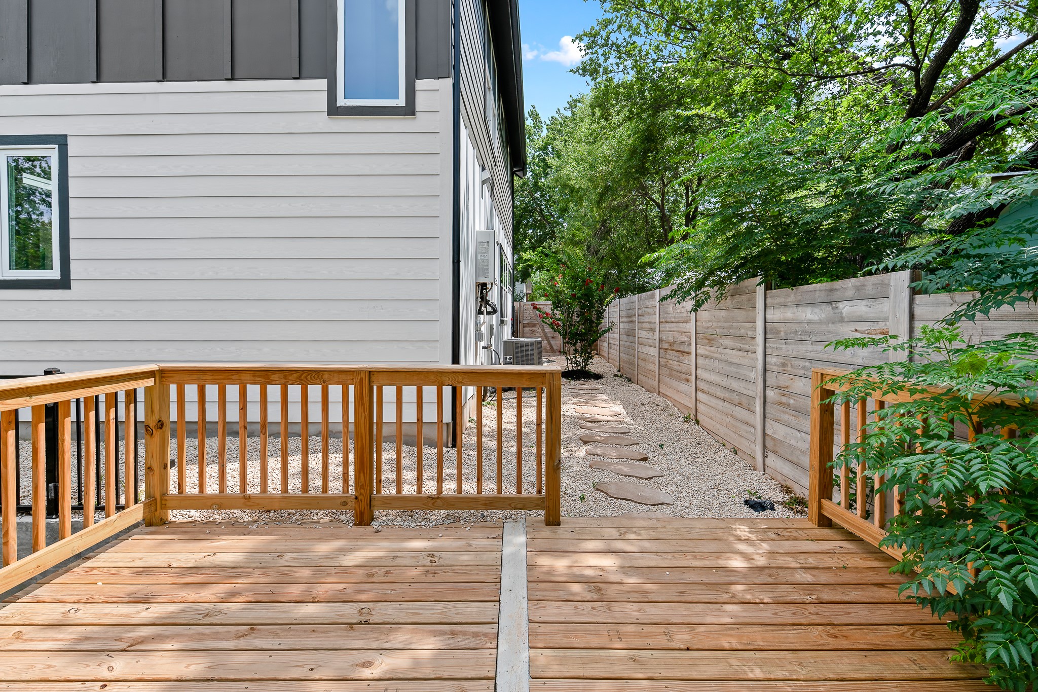 5305 Ledesma Road, Unit 4 Austin, TX 78721 - Photo 39 of 40 A spacious timber deck provides a tranquil outdoor retreat alongside the home.