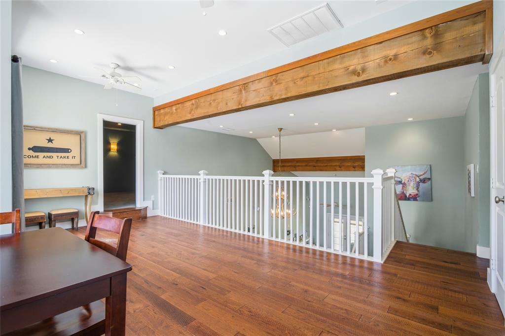 1073 Gordonville Road Gordonville, TX 76245 - Photo 21 of 38 At the top of the stairs, a large loft area serves as another open gathering area.