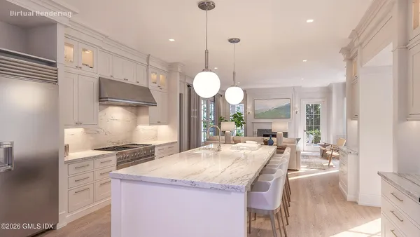 a large kitchen with granite countertop a large stove a sink dishwasher and a refrigerator with wooden floor