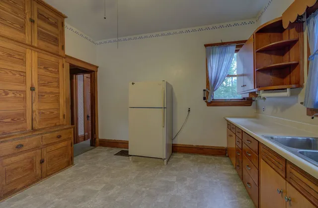 a view of a kitchen with furniture and a window