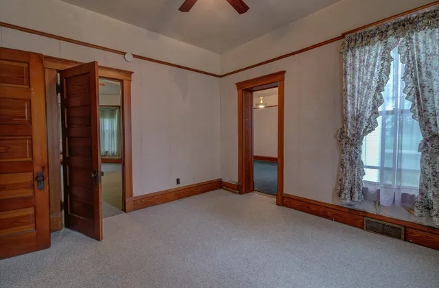 a view of an empty room with a window