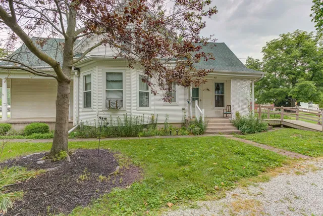 a front view of a house with garden