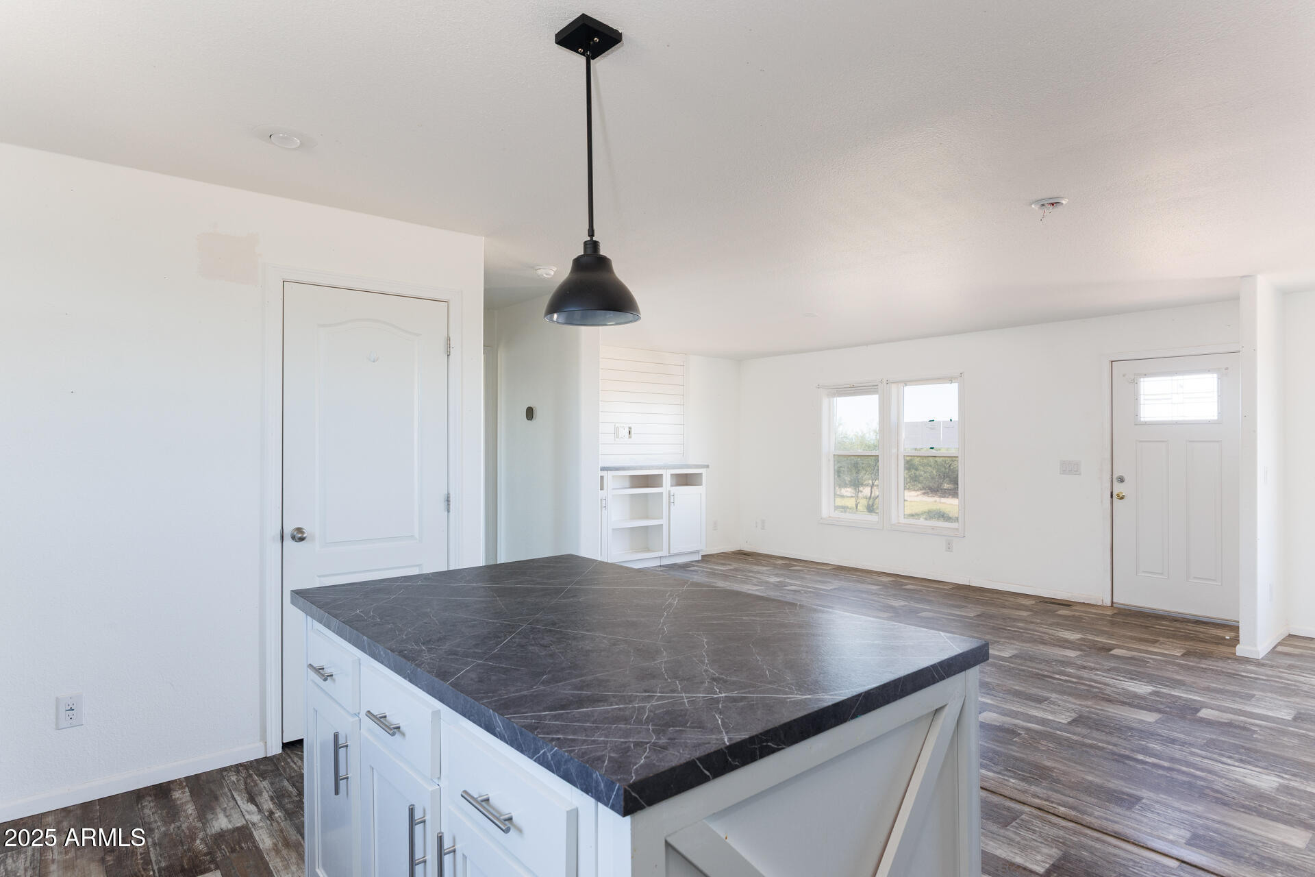 9713 South Thornton Road Casa Grande, AZ 85193 - Photo 11 of 42 an empty room with windows