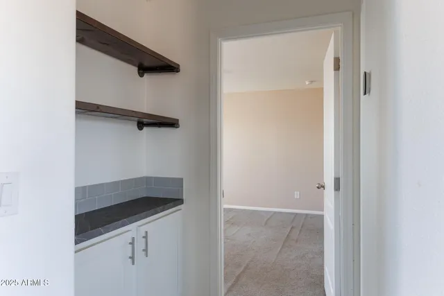 a view of an empty room with a window