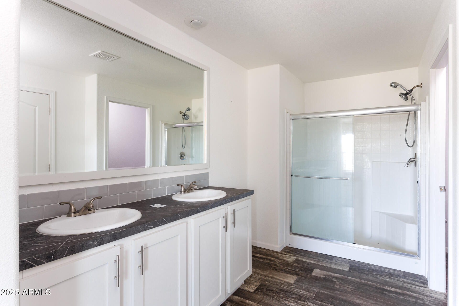 9713 South Thornton Road Casa Grande, AZ 85193 - Photo 17 of 42 a bathroom with a granite countertop sink and a mirror