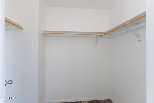 a bathroom with a granite countertop toilet and a sink