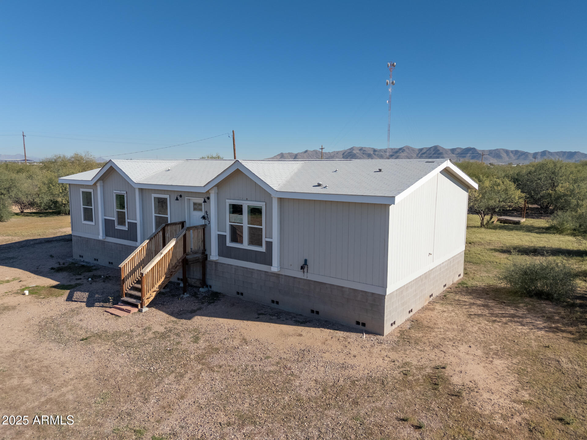 9713 South Thornton Road Casa Grande, AZ 85193 - Photo 29 of 42 a view of a house with backyard and trees