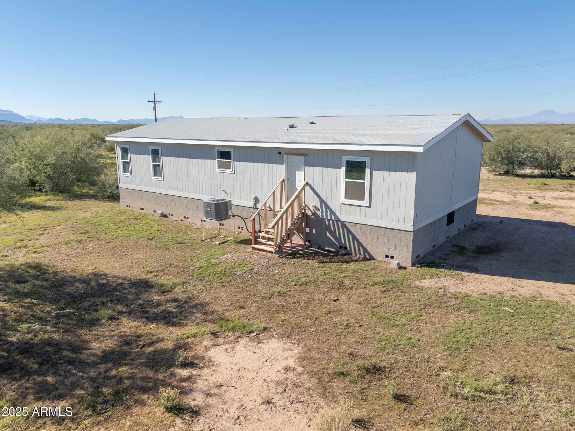 9713 South Thornton Road Casa Grande, AZ 85193 - Photo 31 of 42 a view of a house with backyard