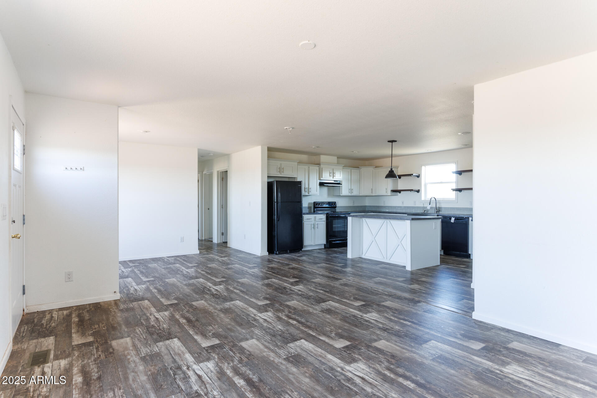 9713 South Thornton Road Casa Grande, AZ 85193 - Photo 7 of 42 a view of a kitchen with wooden floor