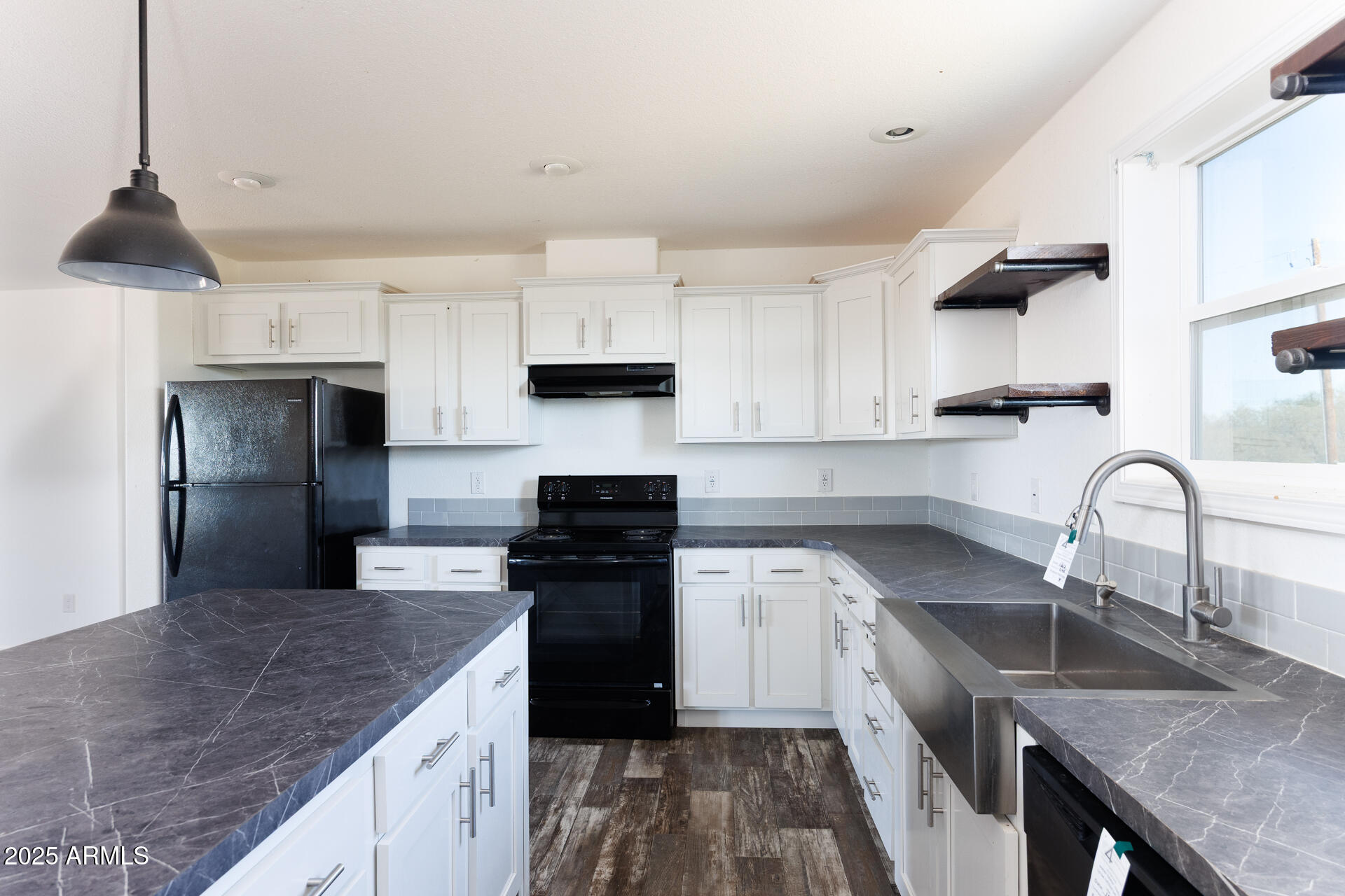 9713 South Thornton Road Casa Grande, AZ 85193 - Photo 10 of 42 a kitchen with stainless steel appliances granite countertop a sink a stove and a refrigerator