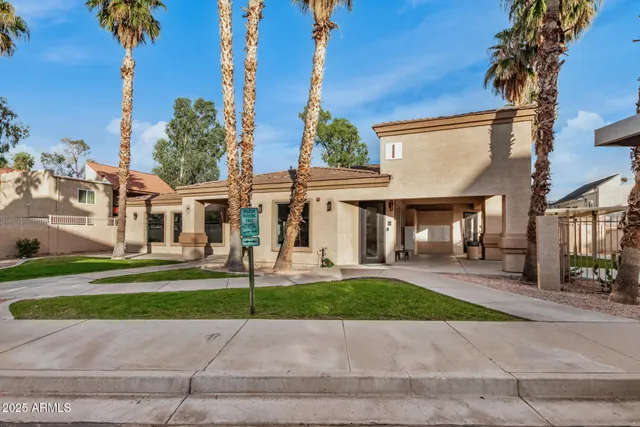 a large kitchen with stainless steel appliances kitchen island a large counter top a stove and a sink