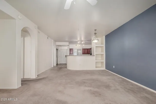 a view of a kitchen with a sink and cabinets