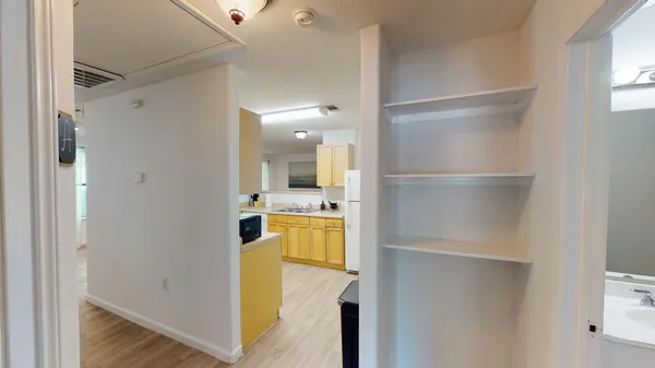a view of balcony with wooden floor and fence