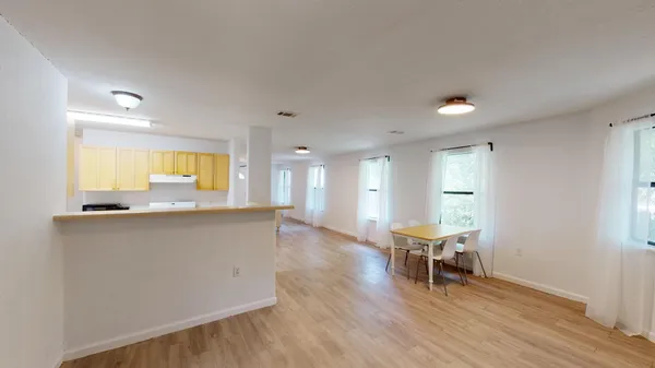 a view of outdoor space with deck and tree