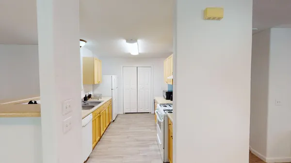 a bathroom with a sink and mirror with toilet