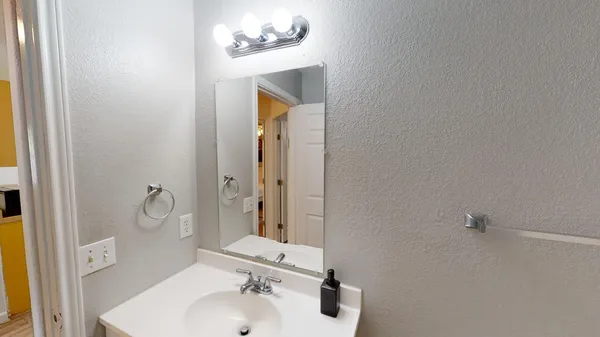 a view of a house with porch and garage