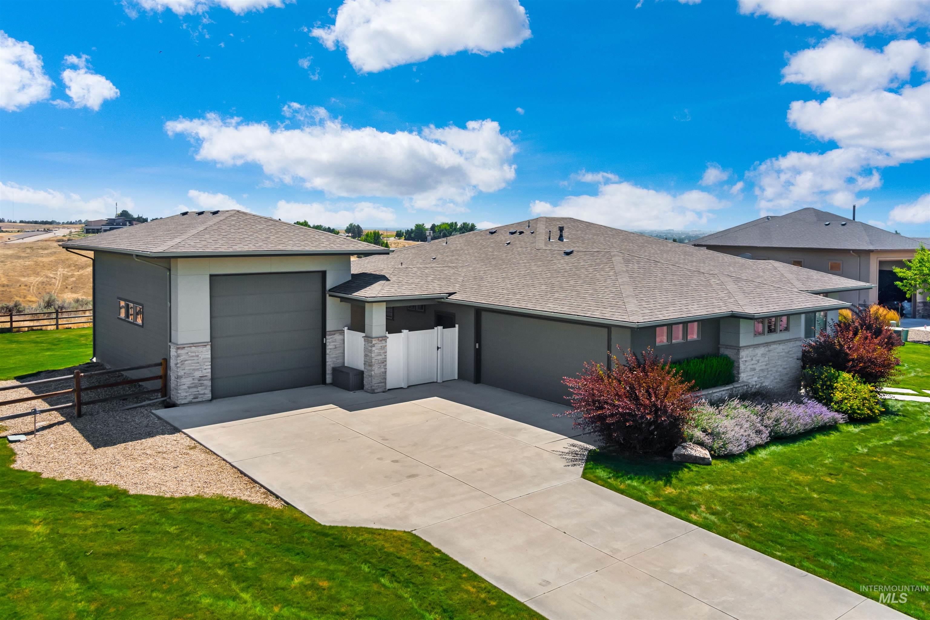 24398 Tombstone Ridge Court Middleton, ID 83644 - Photo 38 of 47 Contemporary ranch-style home featuring a dark gray facade with stone accents