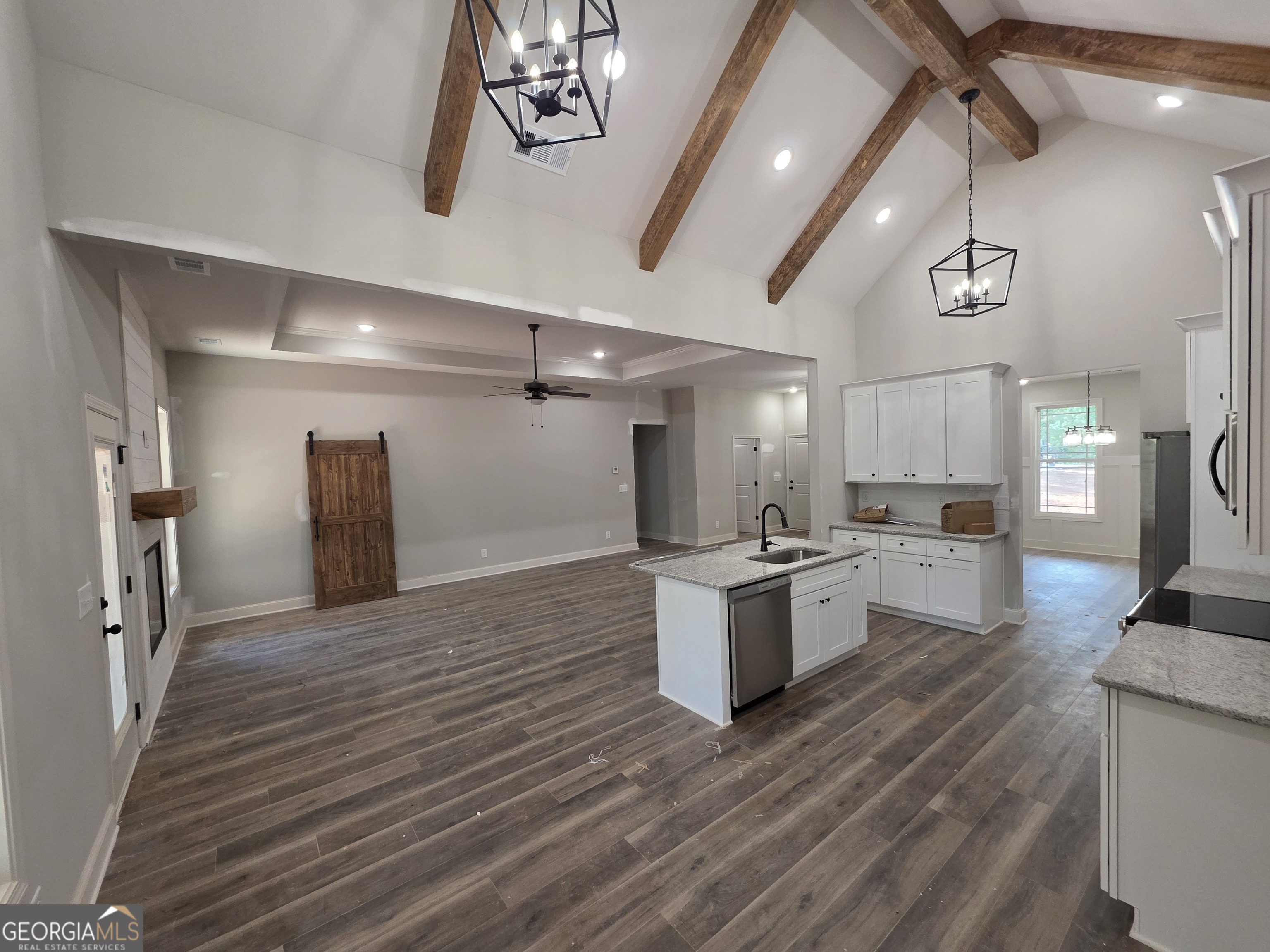 215 Panola Road Jackson, GA 30233 - Photo 6 of 16 a large kitchen with a large counter top appliances and cabinets