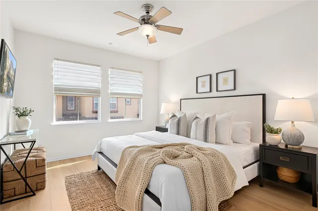 a bedroom with bed and window