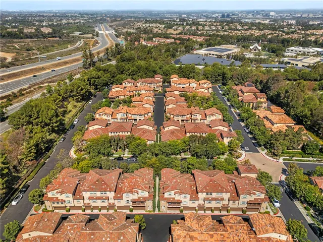 an aerial view of residential houses with outdoor space