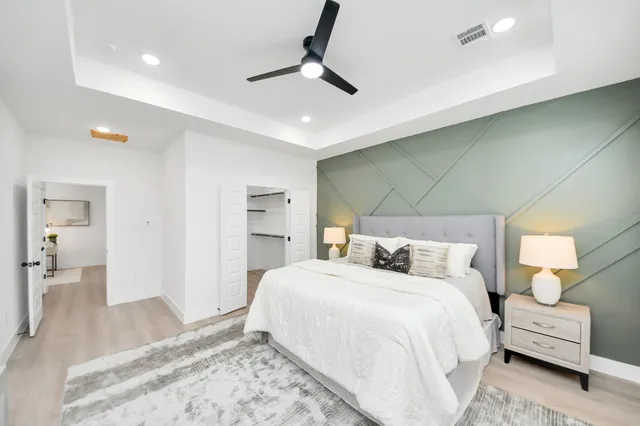 a bedroom with a bed and a couch