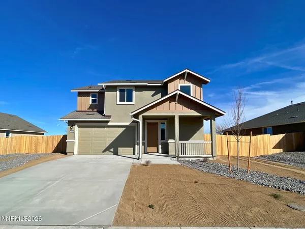 a view of a house with wooden fence