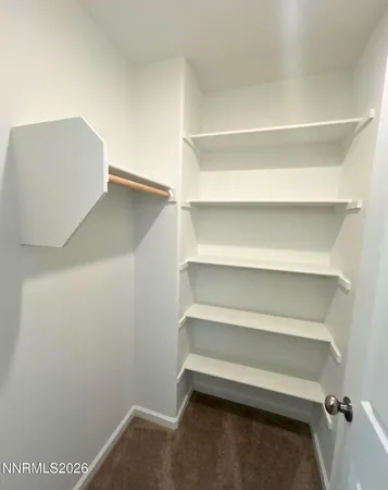 a view of an empty walk in closet