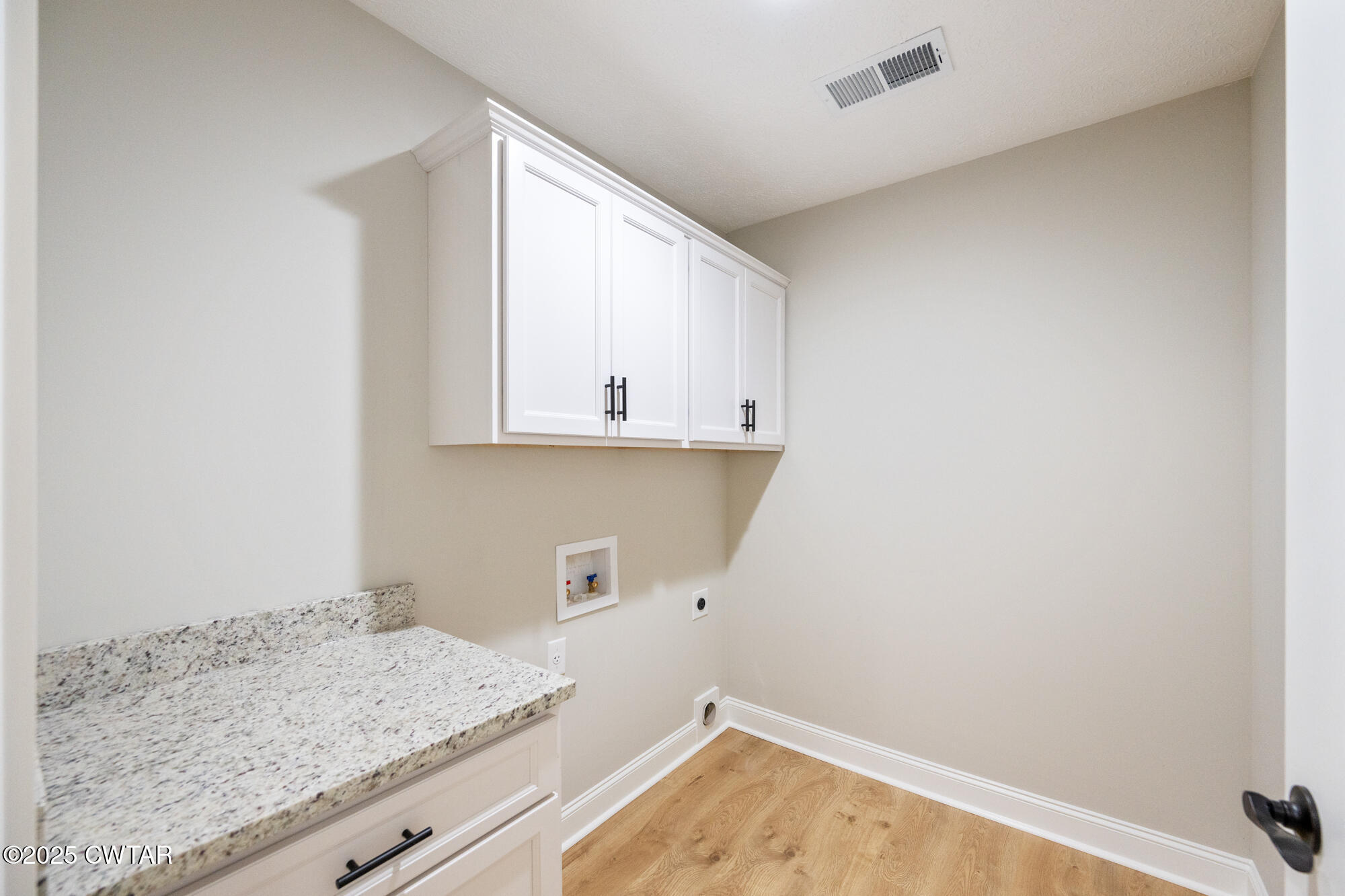 90 Derek Drive Lexington, TN 38351 - Photo 22 of 32 a room with a sink and cabinets