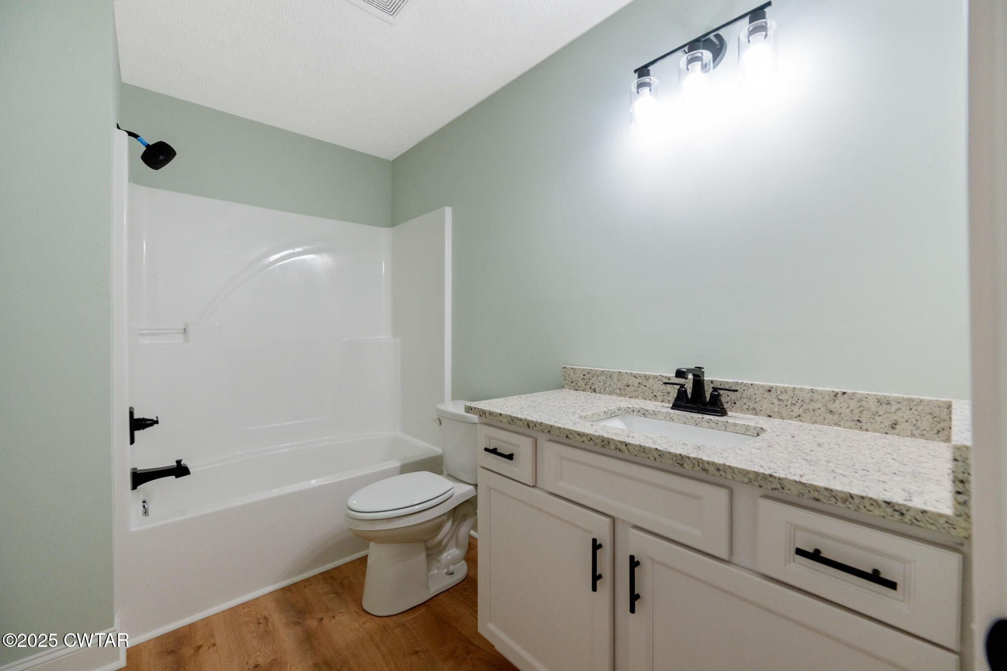 90 Derek Drive Lexington, TN 38351 - Photo 24 of 32 a bathroom with a granite countertop sink toilet and shower