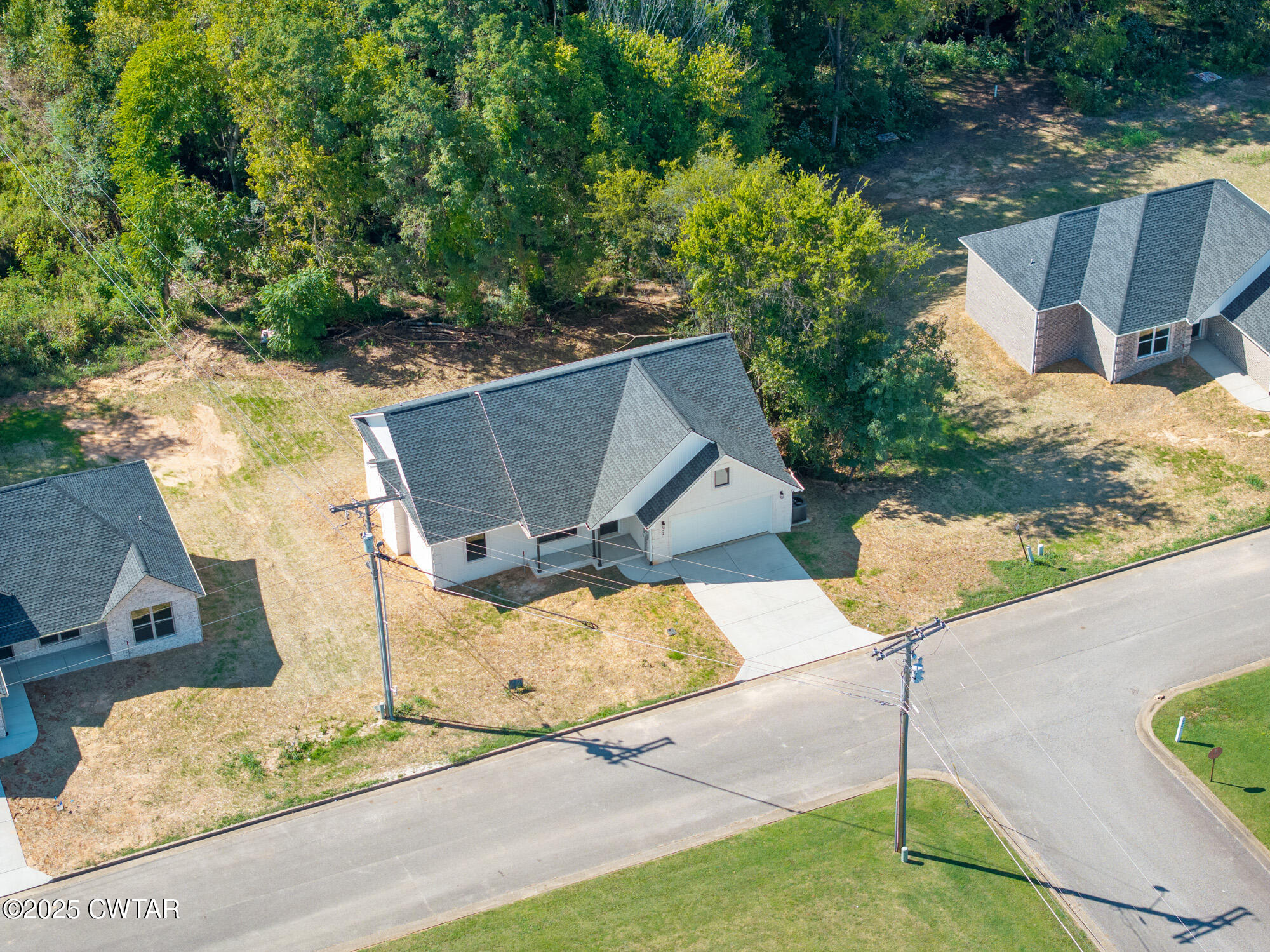 90 Derek Drive Lexington, TN 38351 - Photo 26 of 32 a view of a yard and front a house