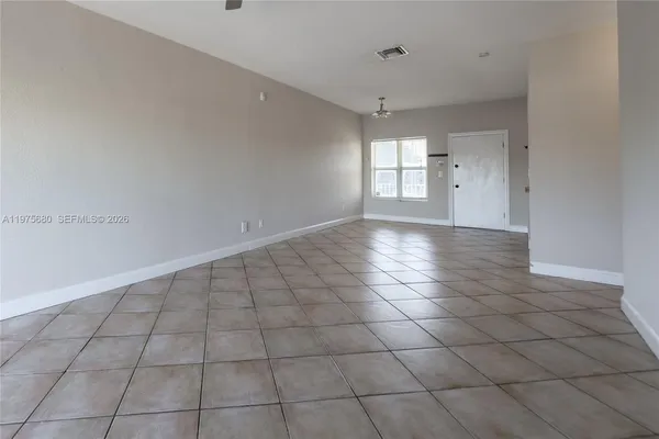 a view of an empty room and window